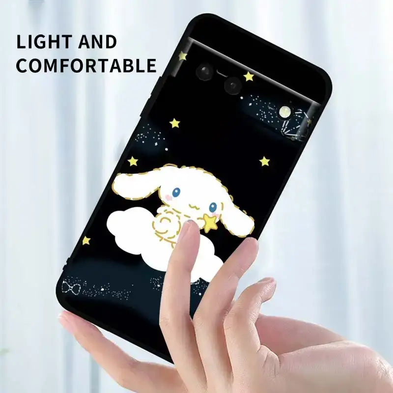 a hand holding a phone with a cartoon sheep on it