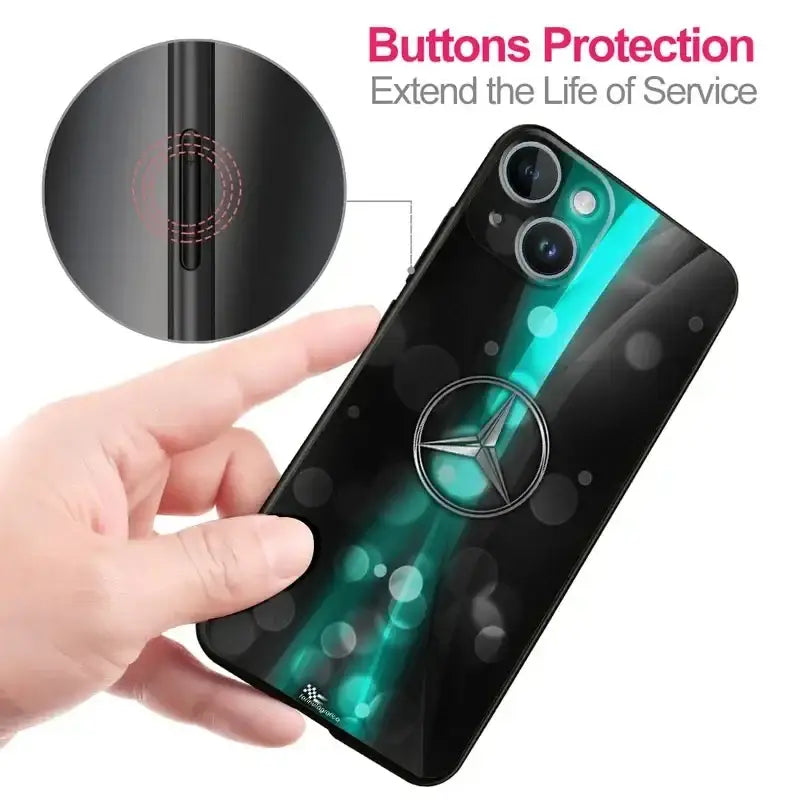 a hand holding a phone case with a button button