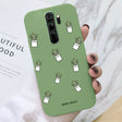 A hand holding a phone case with cactus design