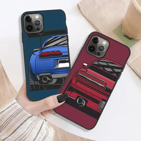 A hand holding a phone case with a car on it