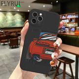 a hand holding a phone case with a car on it