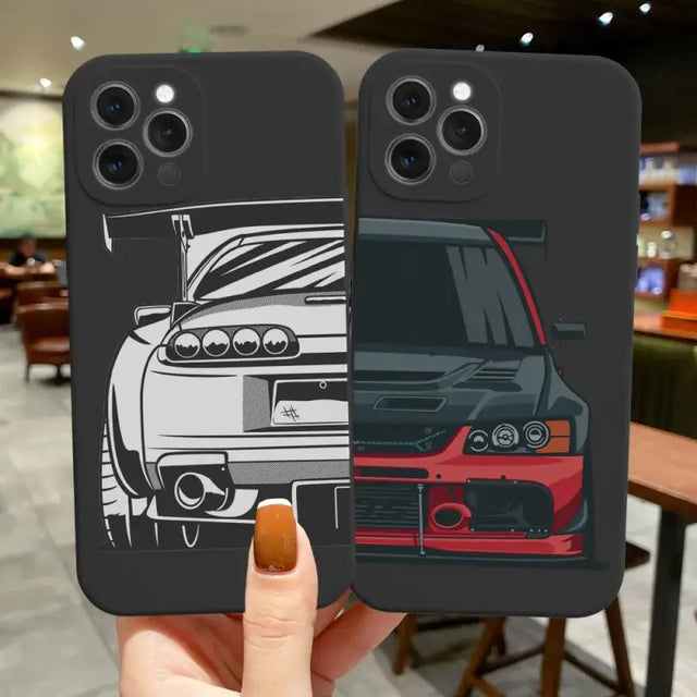 a hand holding a phone case with a car on it