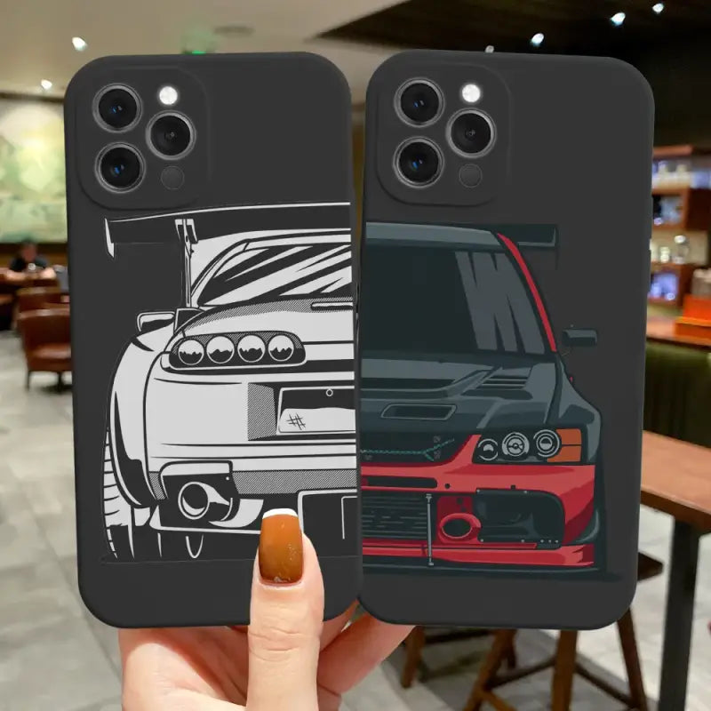 A hand holding a phone case with a car on it