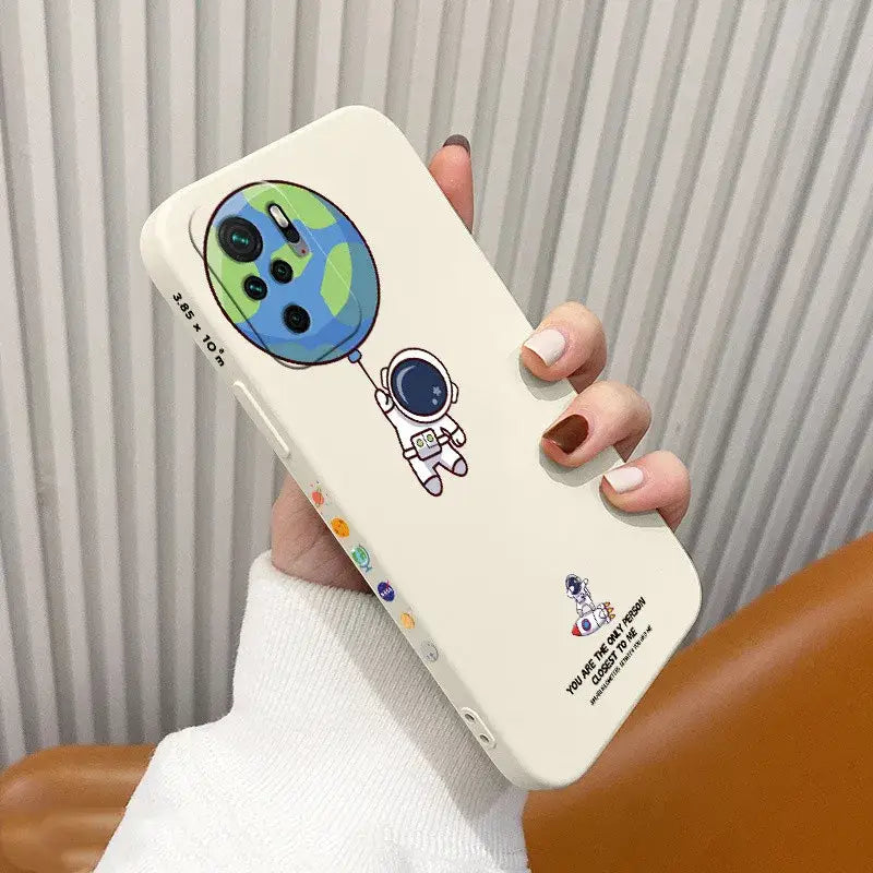 a hand holding a phone case with a cartoon character on it