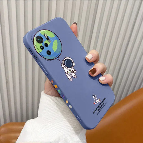 A hand holding a phone case with a cartoon character on it