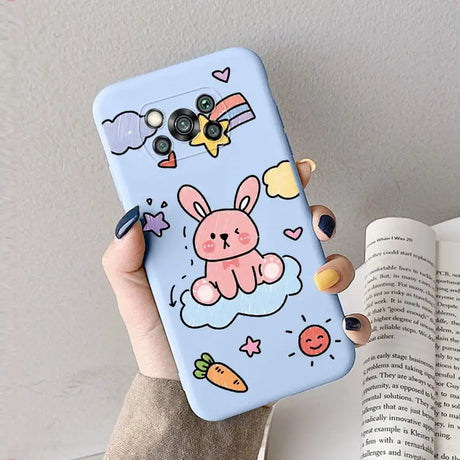 a hand holding a phone case with a cartoon character on it