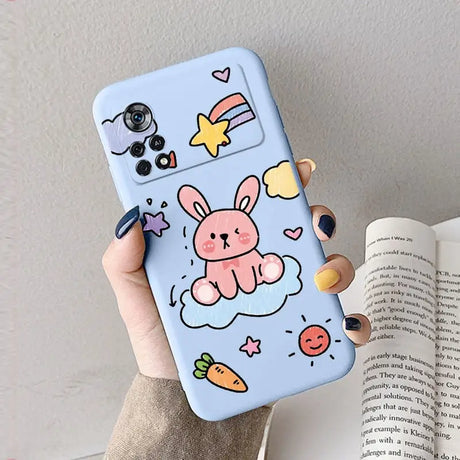 A hand holding a phone case with a cartoon character on it