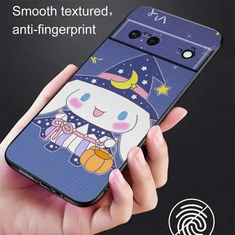 A hand holding a phone case with a cartoon character