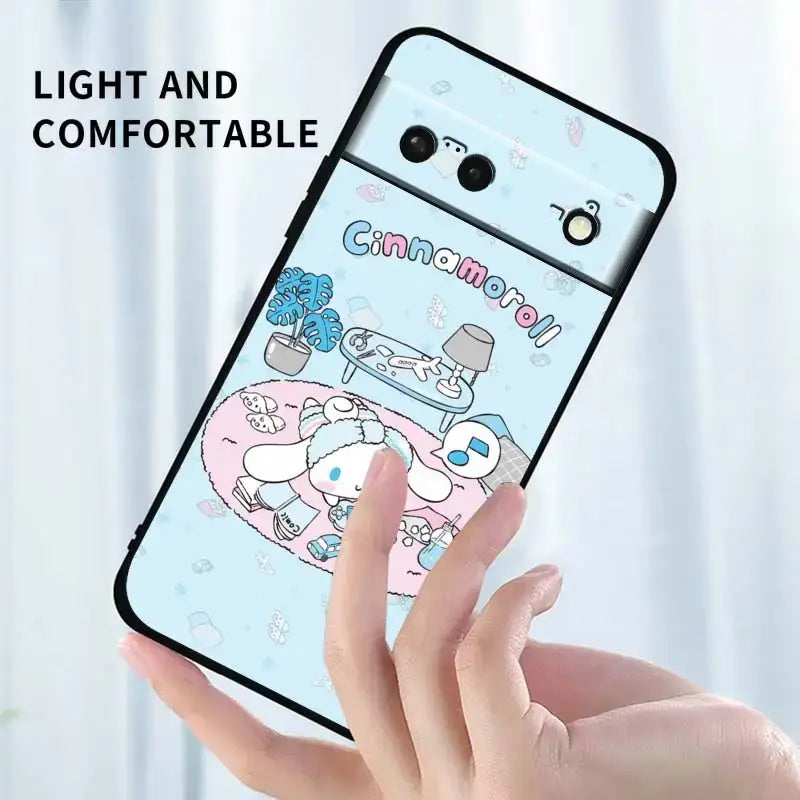 A hand holding a phone case with a cartoon character