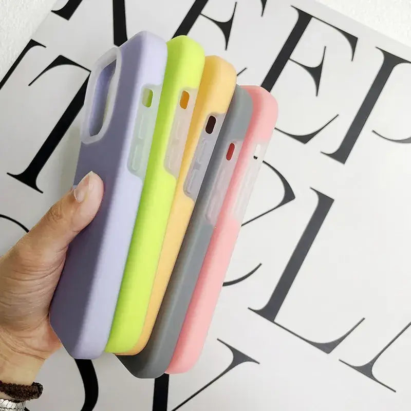 a hand holding a phone case with a colorful design