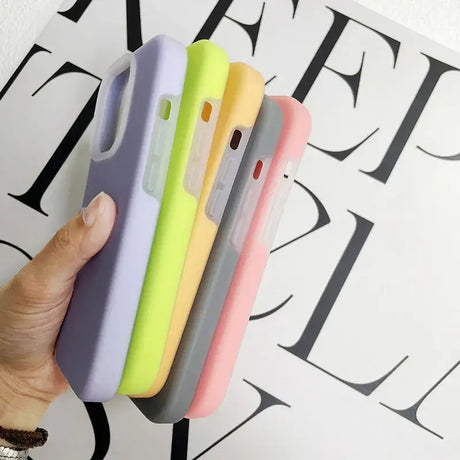 A hand holding a phone case with a colorful design