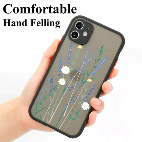 A hand holding a phone case with a flower design