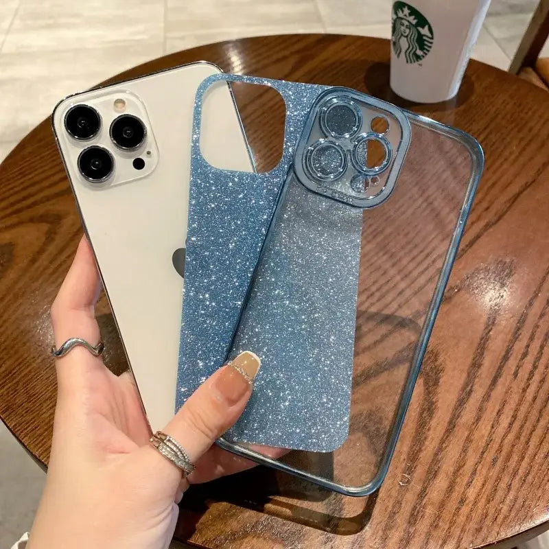 a hand holding a phone case with glitter on it
