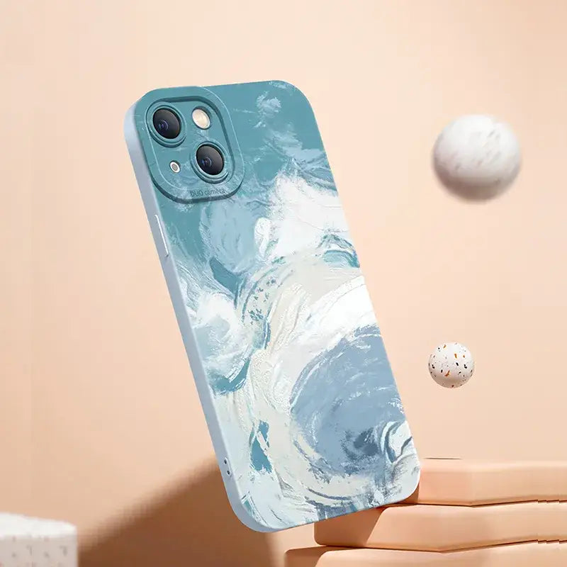 a hand holding a phone case with a marble pattern