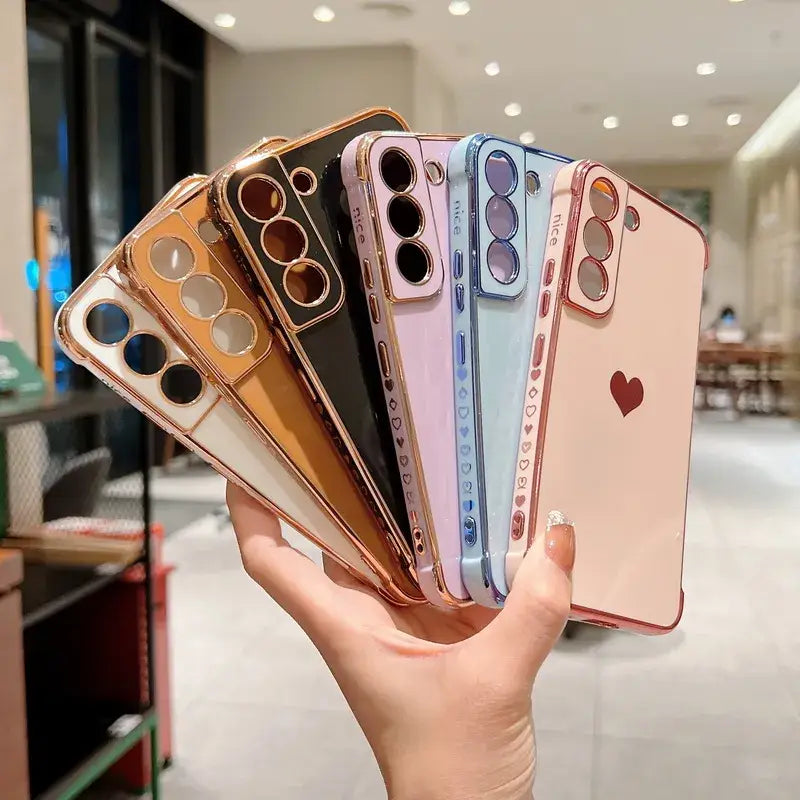 a hand holding a phone case with multiple colors