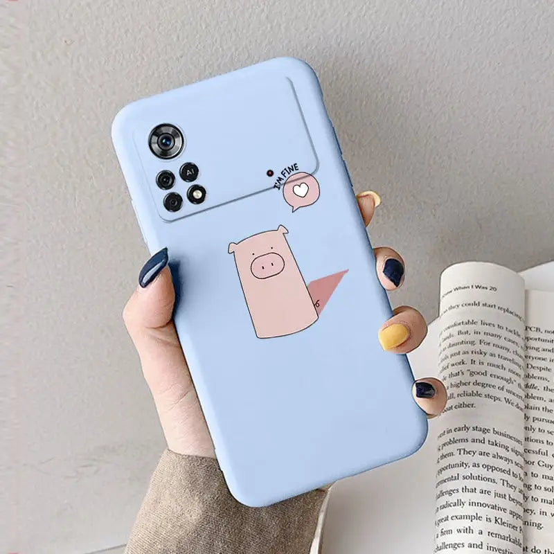 a hand holding a phone case with a pig on it