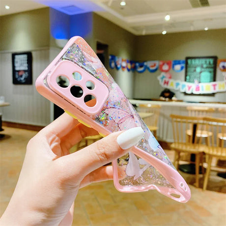 a hand holding a phone case with a pink and white floral design