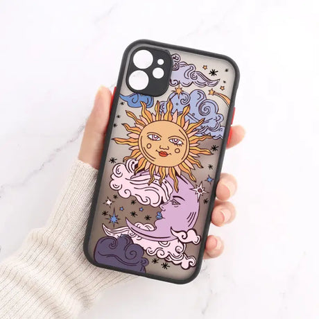 A hand holding a phone case with a drawing of a sun and clouds