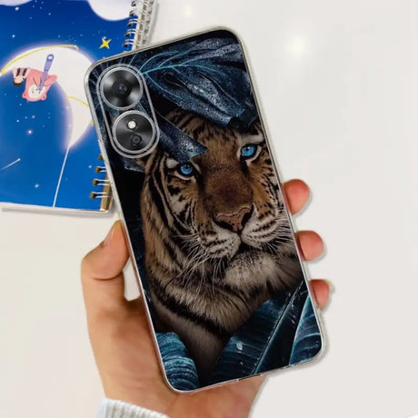 a hand holding a phone case with a tiger on it