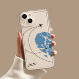 a hand holding a phone case with a world map on it
