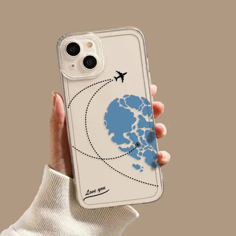 A hand holding a phone case with a world map on it