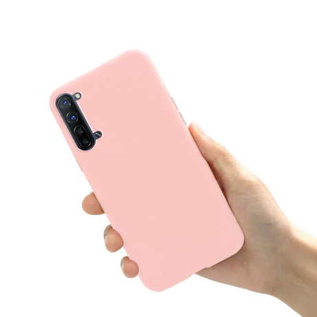 a hand holding a pink iphone case