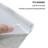 a hand holding a plastic tray with a white sheet