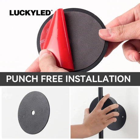 a hand holding a red and black puck
