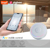 A hand holding a smart phone with a smart light