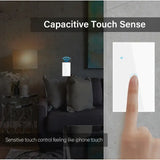 a hand is pointing at a touch screen