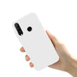 A hand holding a white phone case