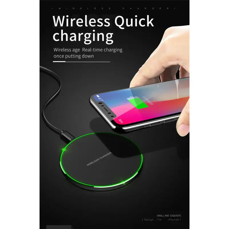 a hand holding a wireless charger with a phone in the background