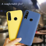 a hand holding a yellow and blue case for the xiao pixel