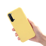 a hand holding a yellow iphone case