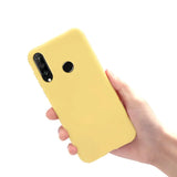 A hand holding a yellow iphone case