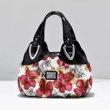 a handbag with a floral pattern on it