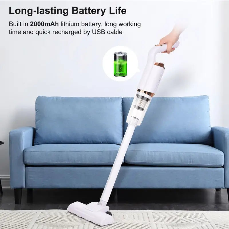 a person using a long - lasting stick to clean a couch