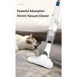 the cat is laying down on the floor with the vacuum