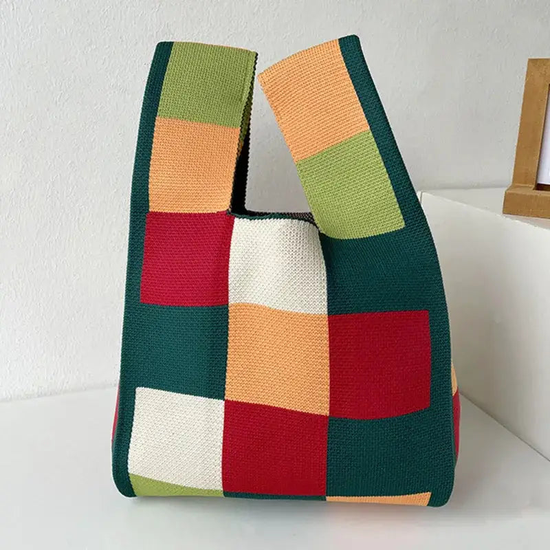 a handmade bag with a multi colored pattern