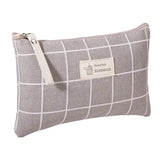 the grey and white plaid pattern on this small pouch is a great way to keep your belongings organized