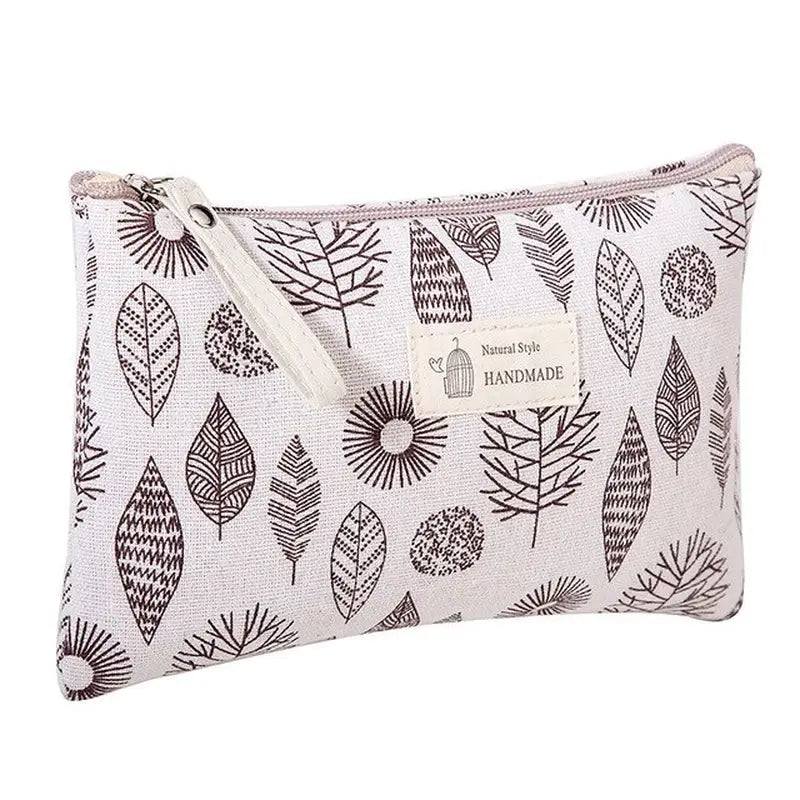 the small cosmetic bag in grey leaves