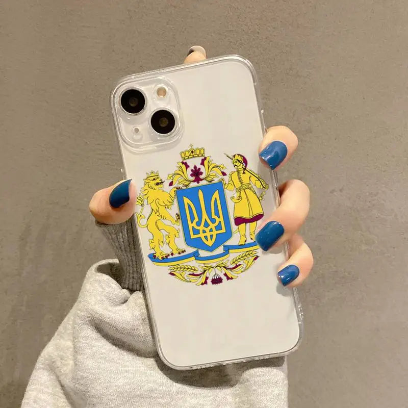 a woman holding a phone case with a coat of arms on it