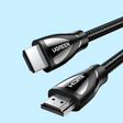 HDMI cable with braided black cord and UGREEN branding on the connectors.