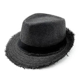a black hat with fringes on the br