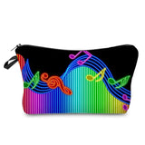 a colorful rainbow colored music notes on a black background cosmetic bag