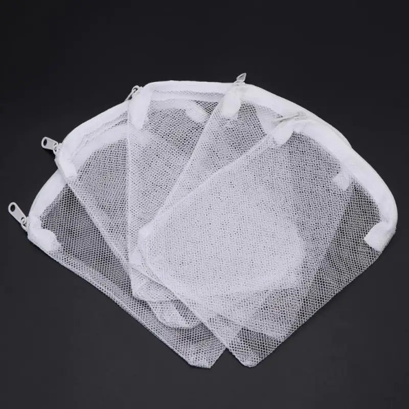three mesh bags with white handles