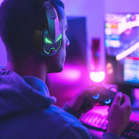 Gaming headset with glowing green accents worn by a person in a dimly lit, colorful environment.