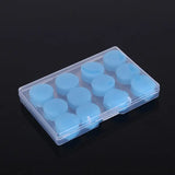 a small plastic box with blue candles inside