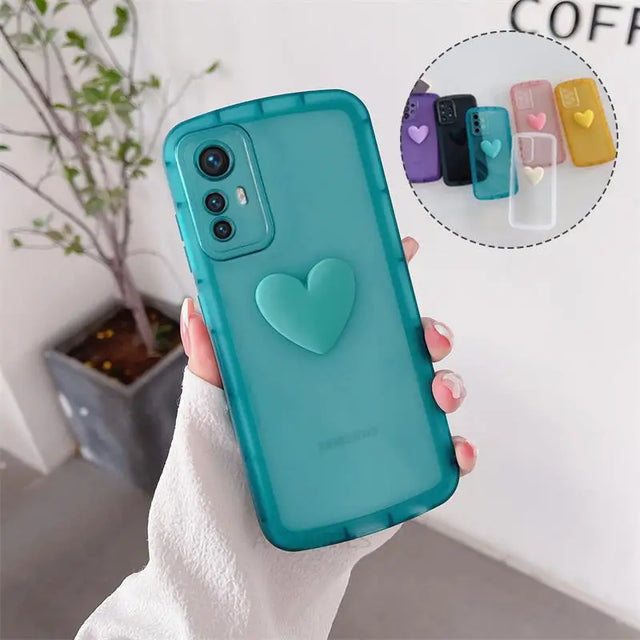 a woman holding a phone case with a heart on it