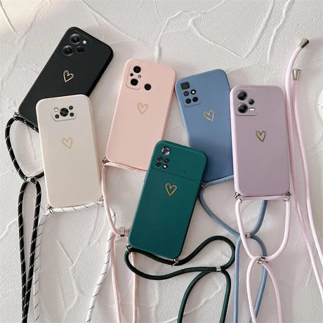 a set of four phone cases with a heart on the back